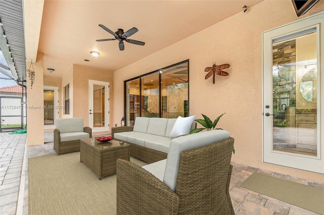 view of patio / terrace with an outdoor living space and ceiling fan