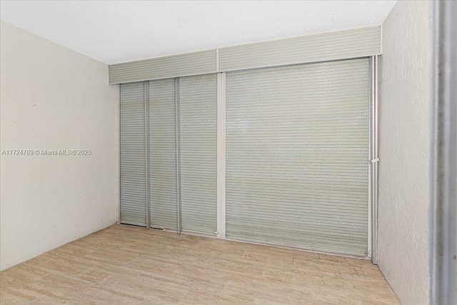 interior space featuring a closet and light hardwood / wood-style floors