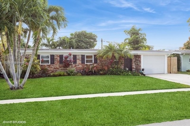 ranch-style house with a garage and a front yard