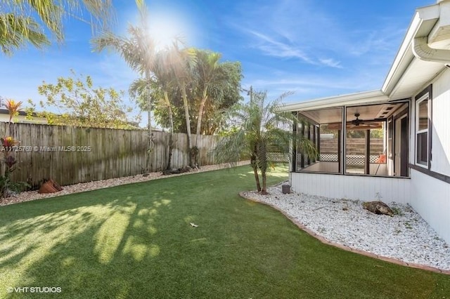 view of yard with a sunroom