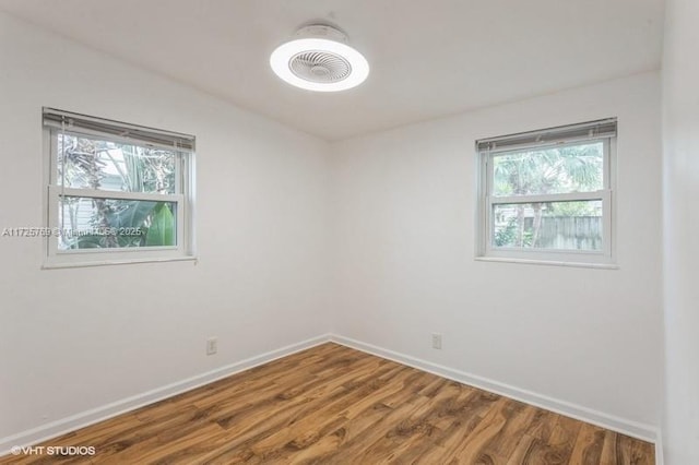 empty room with wood-type flooring