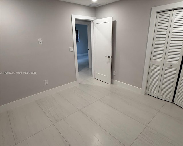 unfurnished bedroom featuring a closet