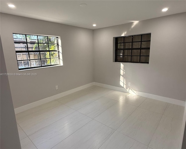 spare room with light tile patterned floors