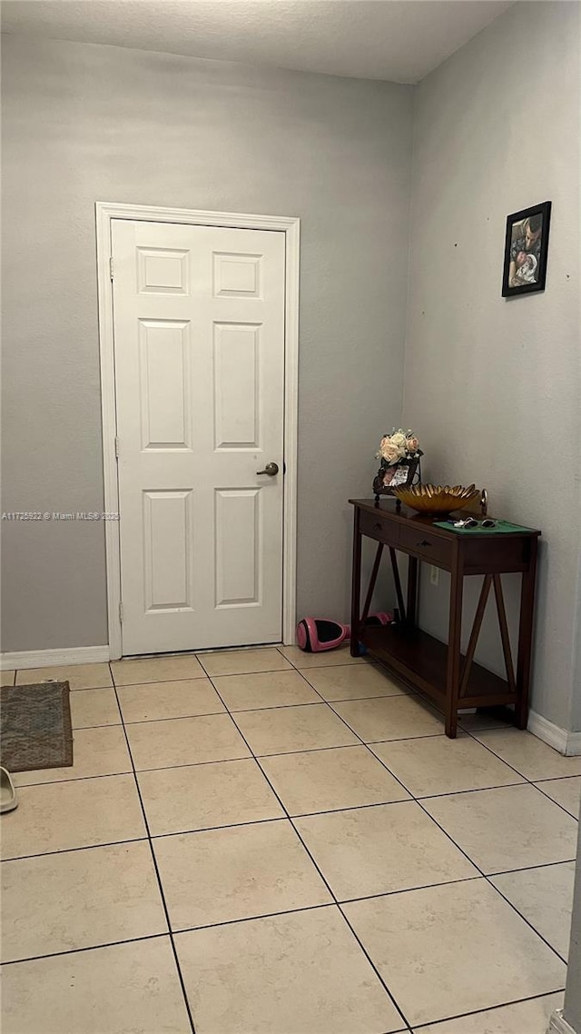 interior space featuring light tile patterned flooring