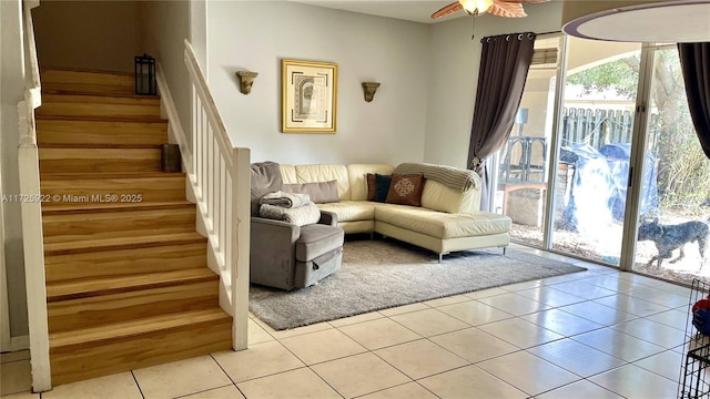 living room with light tile patterned flooring and ceiling fan