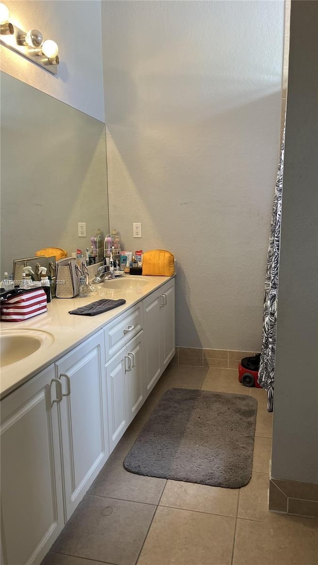 bathroom featuring tile patterned floors and vanity