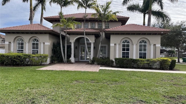 exterior space with a patio area, a front yard, and french doors