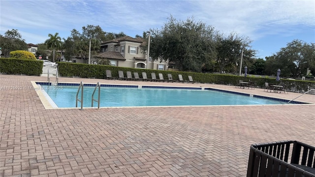 view of pool featuring a patio area