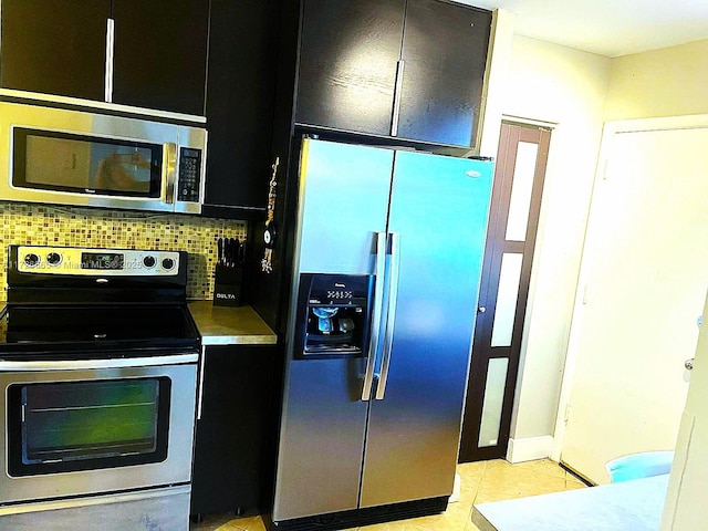 kitchen featuring stainless steel appliances and backsplash