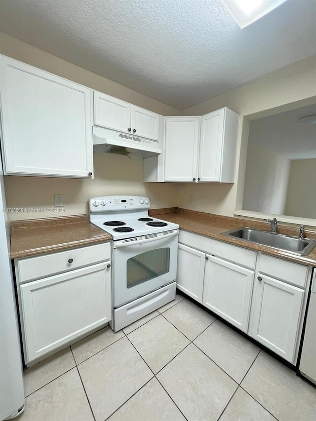 kitchen featuring sink, white cabinetry, white electric range oven, and light tile patterned flooring