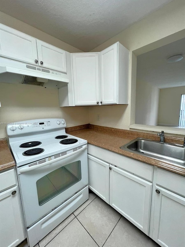 kitchen featuring sink, light tile patterned flooring, white cabinetry, white electric stove, and a textured ceiling