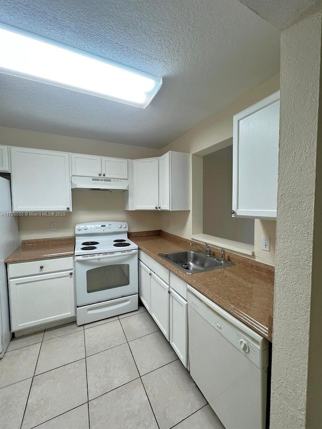 kitchen featuring white cabinetry, sink, and white appliances