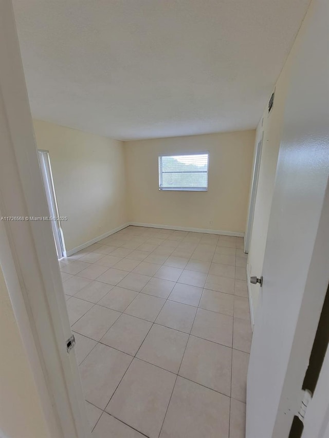 view of tiled spare room