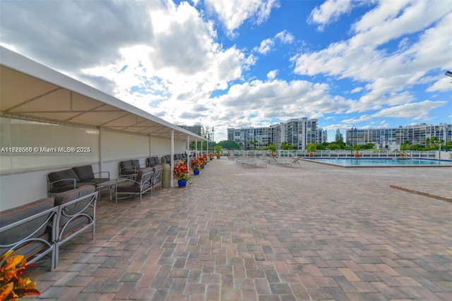 view of patio / terrace featuring a community pool