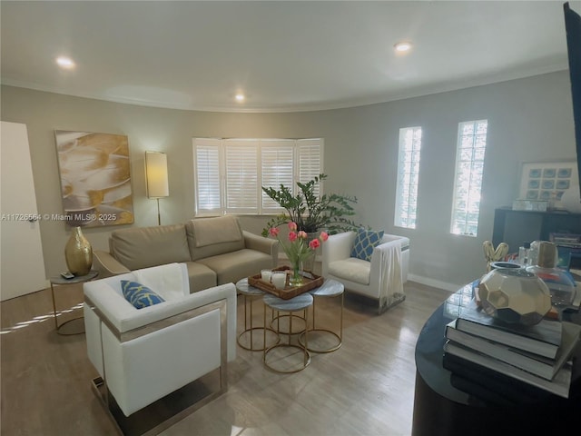 living room featuring recessed lighting, baseboards, and wood finished floors