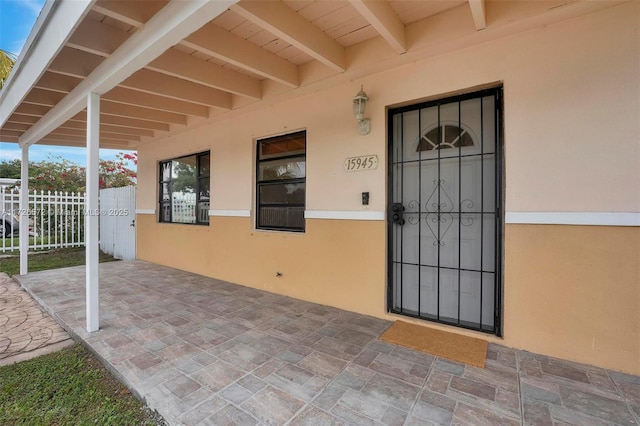 doorway to property featuring a patio area