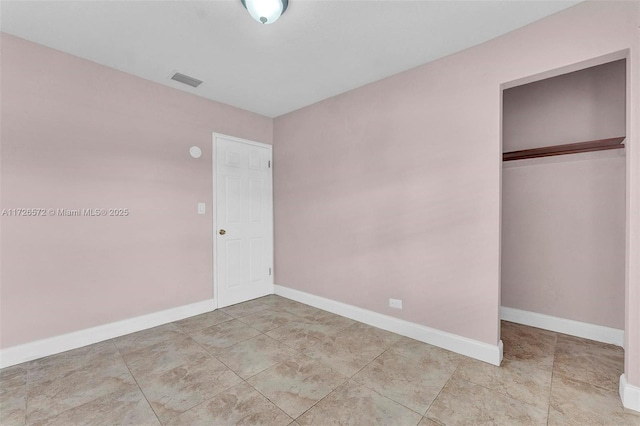 unfurnished bedroom with a closet