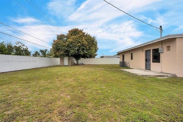 view of yard featuring cooling unit and a patio area