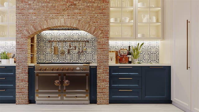 bar with double oven range, blue cabinets, and brick wall