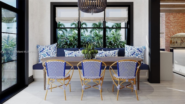 dining room with breakfast area and a chandelier