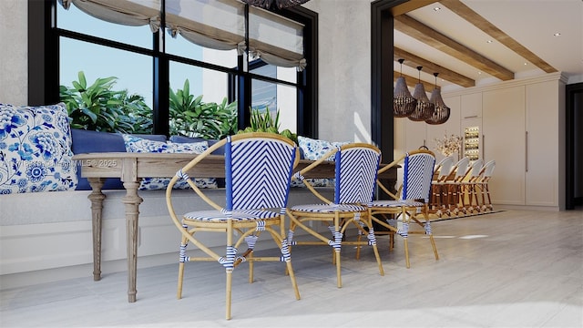 dining space featuring beam ceiling