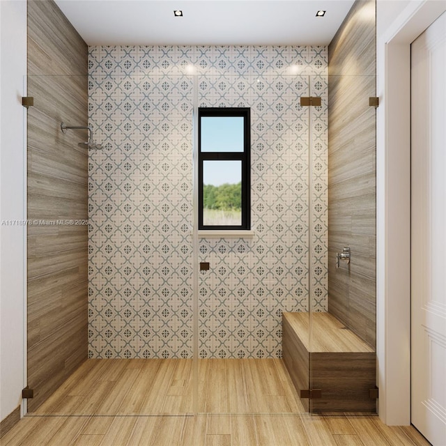full bathroom featuring tiled shower