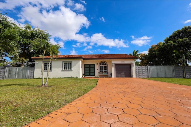 view of front facade with a front lawn and a garage