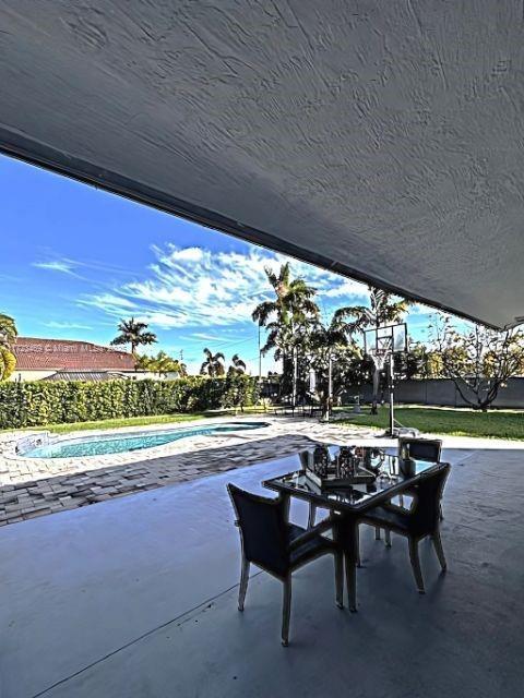 view of patio / terrace featuring a fenced in pool