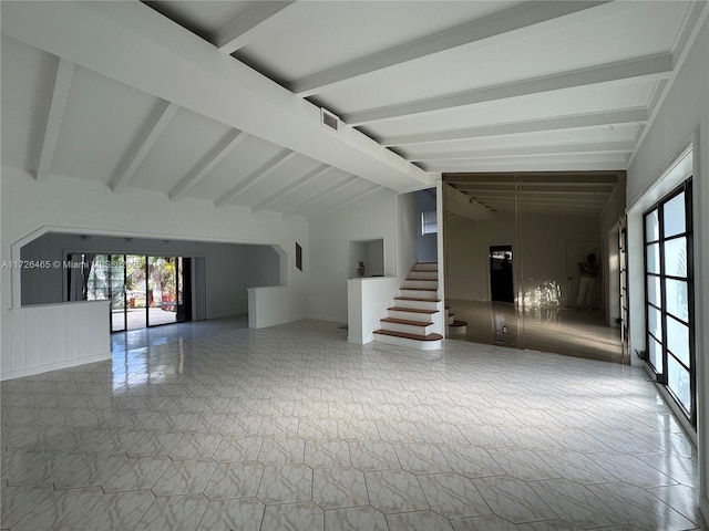 unfurnished room with vaulted ceiling with beams