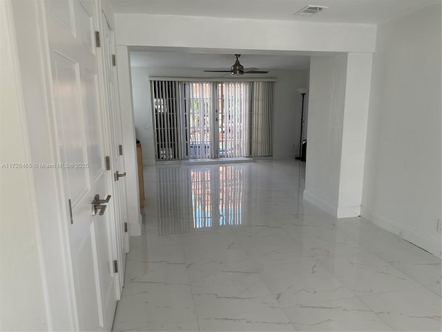 unfurnished room with french doors and ceiling fan