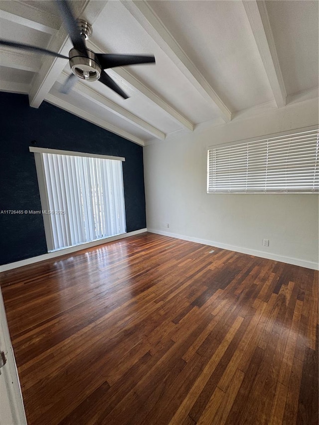 empty room with ceiling fan, lofted ceiling with beams, and hardwood / wood-style floors