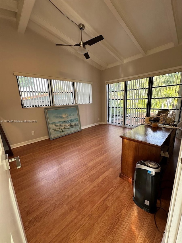 home office featuring vaulted ceiling with beams, hardwood / wood-style floors, and ceiling fan