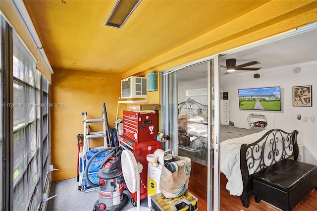 bedroom with hardwood / wood-style flooring