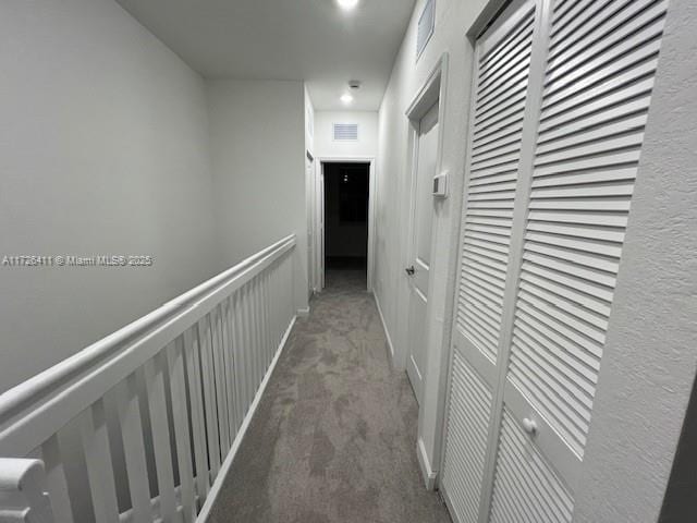 corridor with carpet floors