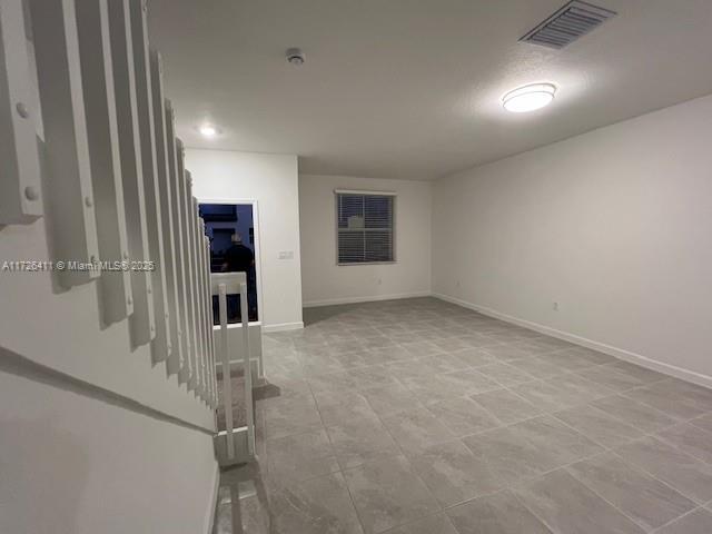 2878 SE 26th Ter Unit 2878, Homestead, FL 33035 - spare room featuring baseboards