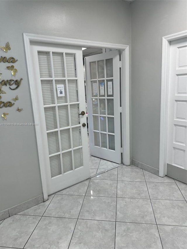 doorway featuring light tile patterned floors