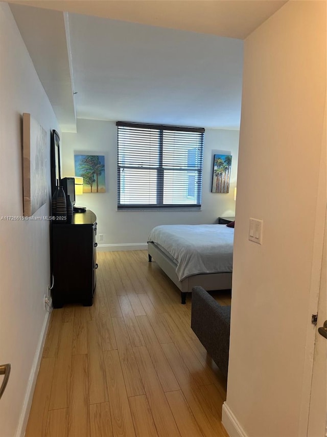 bedroom featuring light wood-type flooring