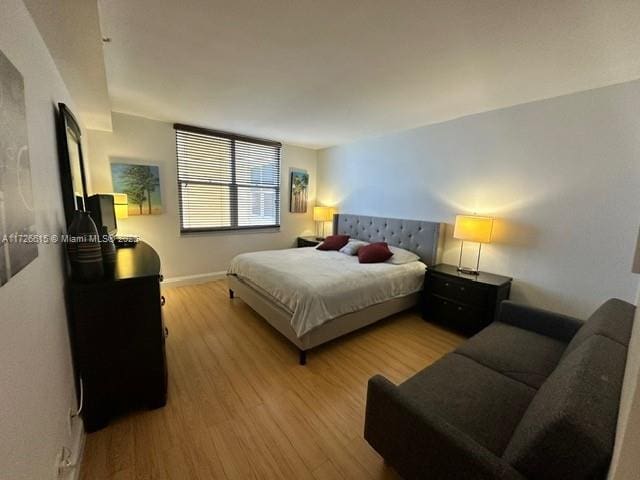 bedroom with light hardwood / wood-style floors