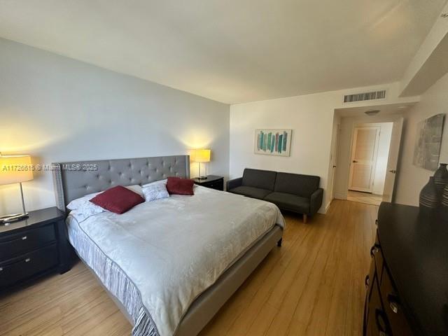 bedroom with light hardwood / wood-style flooring