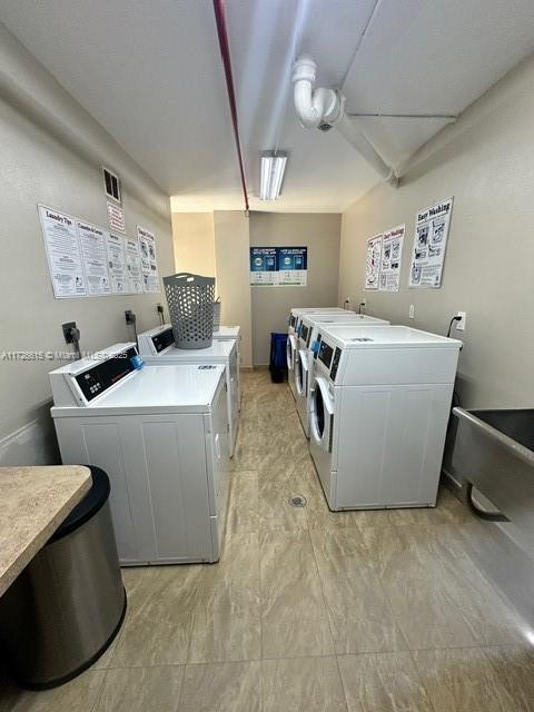 washroom with separate washer and dryer