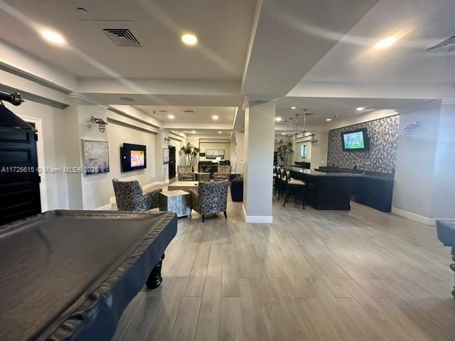 recreation room with pool table and hardwood / wood-style flooring