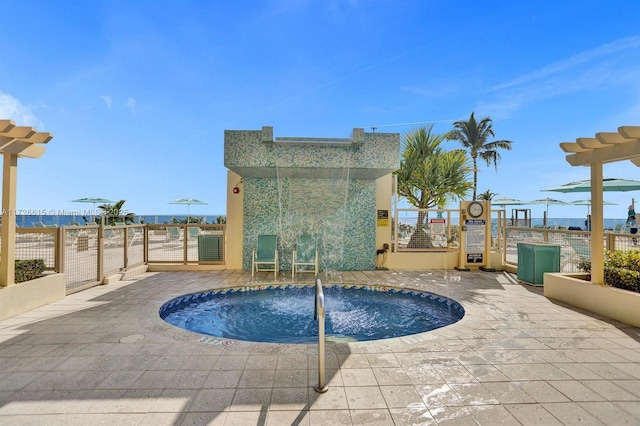 view of pool with a water view