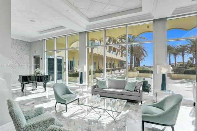 sunroom featuring a raised ceiling