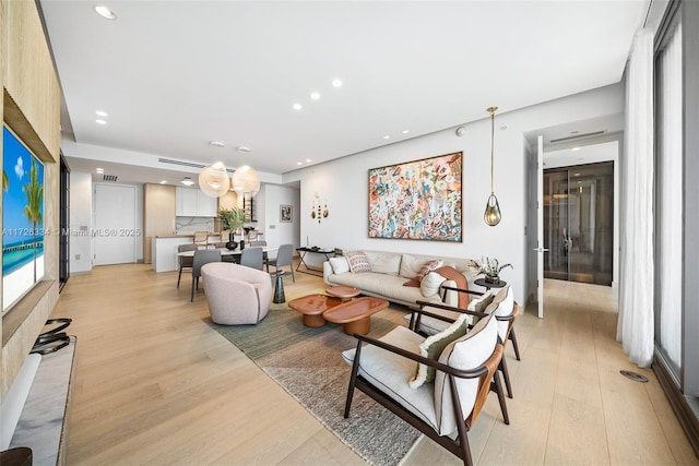 living room with light hardwood / wood-style flooring