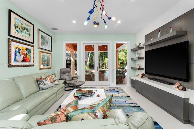 living room featuring french doors and built in shelves