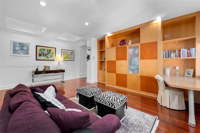 living room with dark wood-type flooring and built in features