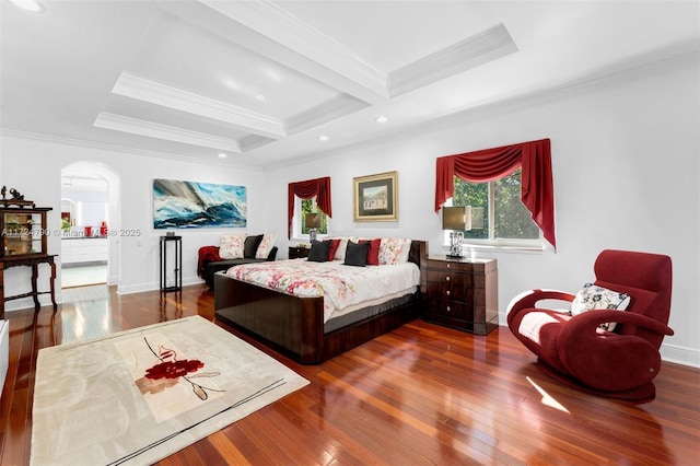 bedroom with dark hardwood / wood-style floors, ornamental molding, and beamed ceiling