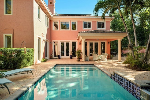 back of house with french doors and a patio area