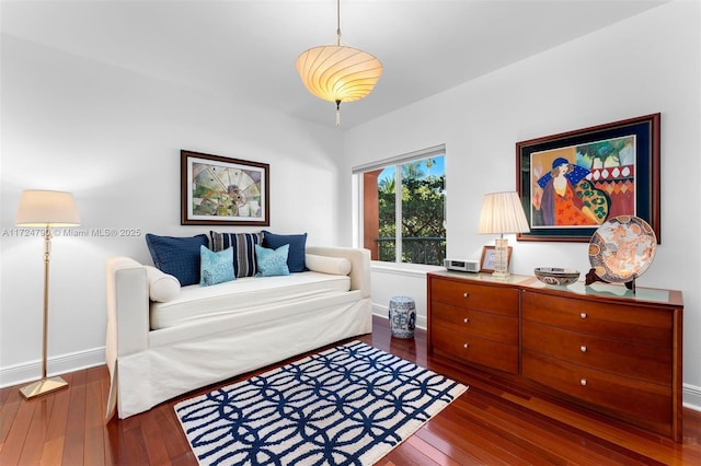 bedroom with dark hardwood / wood-style floors