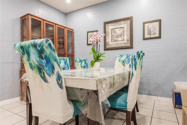 dining area featuring light tile patterned floors